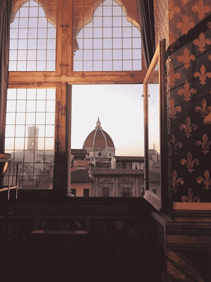 A view of the Florence Cathedral through a window.